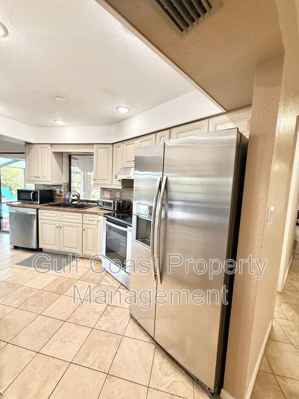 Stunning Furnished Pool him on Accessible Canal property image