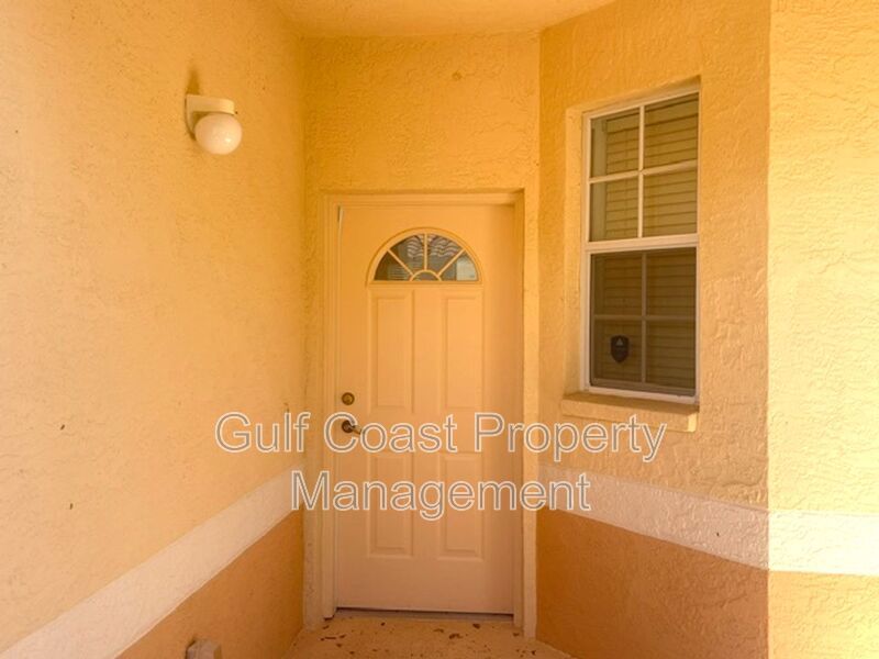 Elegant 3 Bedroom End-Unit Condo with Screened Lanai & Pond Views and A Private Garage property image