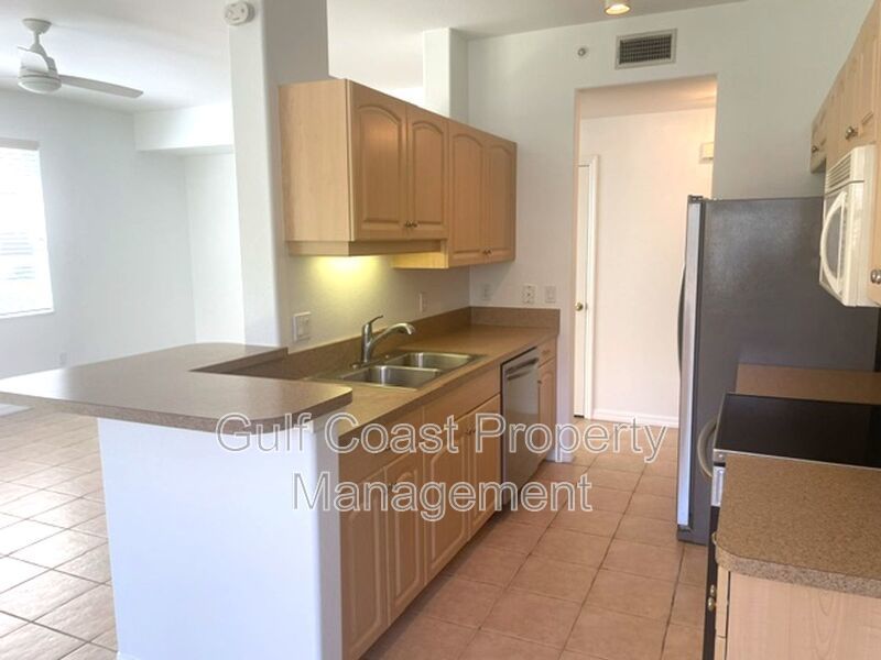 Elegant 3 Bedroom End-Unit Condo with Screened Lanai & Pond Views and A Private Garage property image
