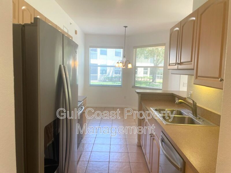 Elegant 3 Bedroom End-Unit Condo with Screened Lanai & Pond Views and A Private Garage property image