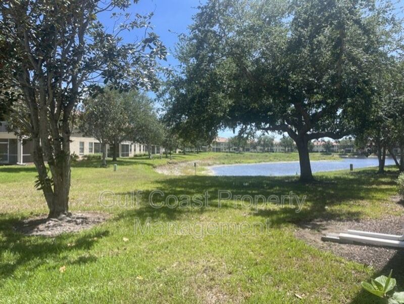 Elegant 3 Bedroom End-Unit Condo with Screened Lanai & Pond Views and A Private Garage property image