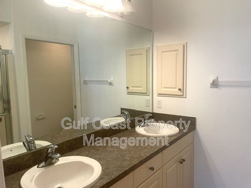 Elegant 3 Bedroom End-Unit Condo with Screened Lanai & Pond Views and A Private Garage property image