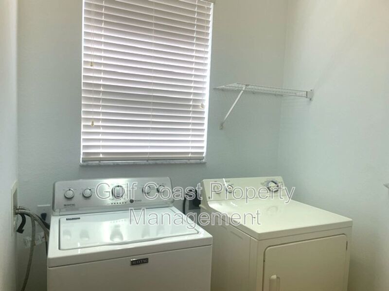 Elegant 3 Bedroom End-Unit Condo with Screened Lanai & Pond Views and A Private Garage property image
