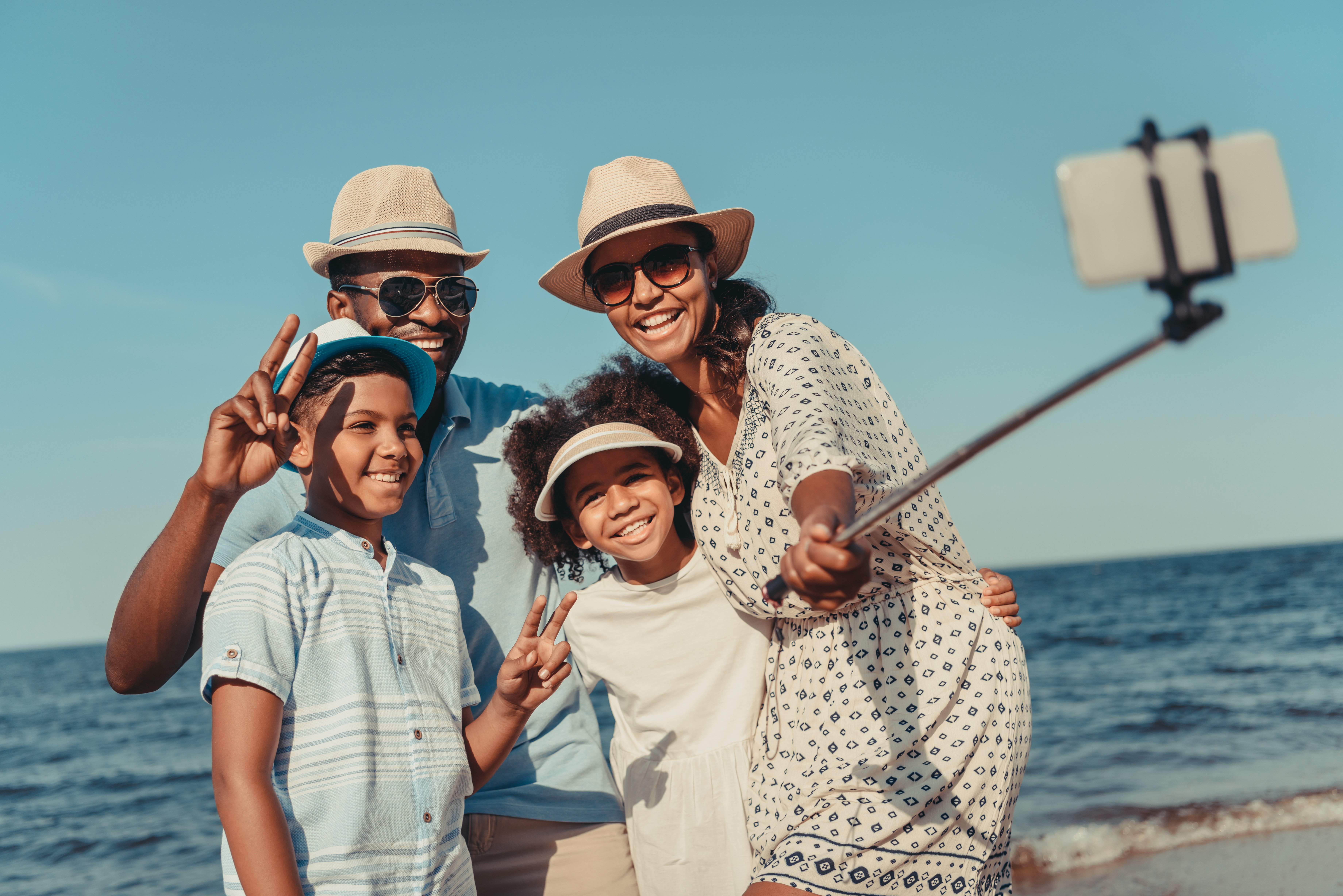 Family taking selfie on beach