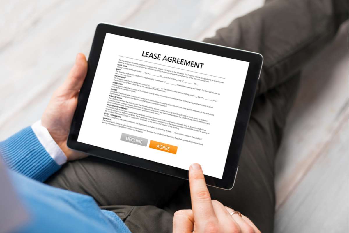 Man reading lease agreement (R) (S)