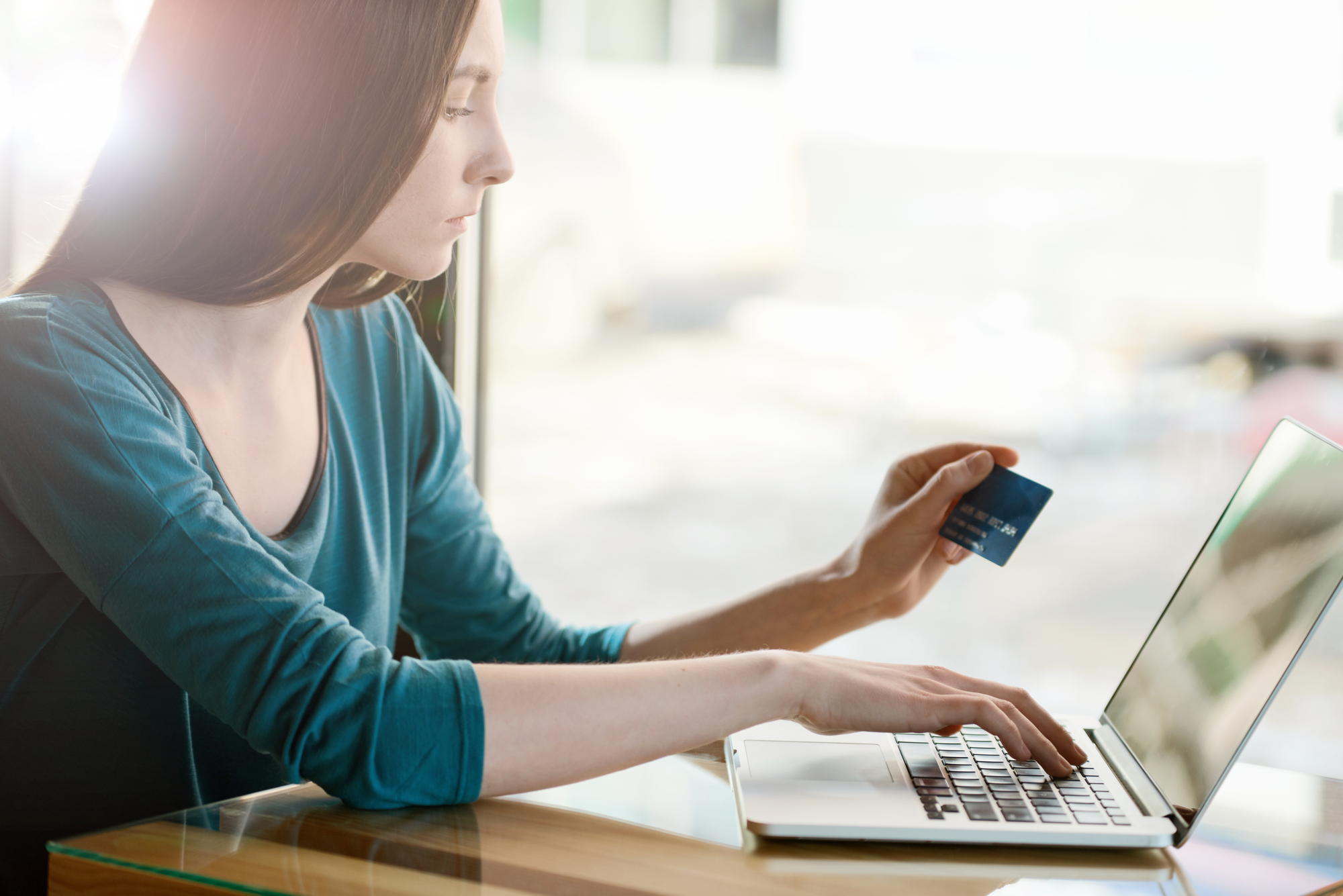 Woman paying with credit card online